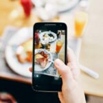 woman using her camera of phone