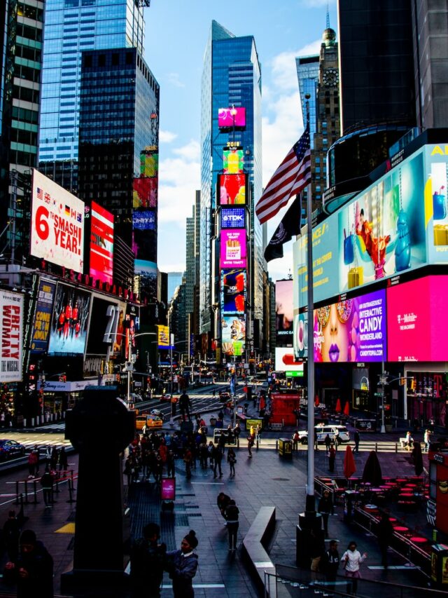 group of people walking near high-rise buildings