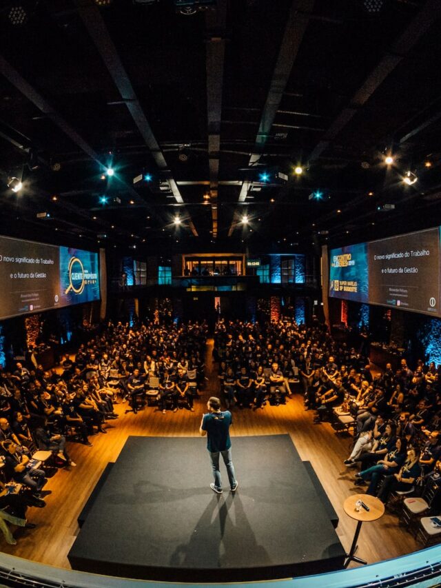people sitting on chairs watching a game