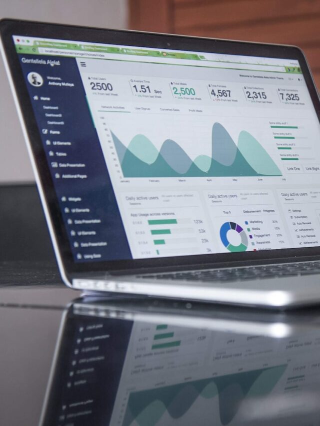 laptop computer on glass-top table