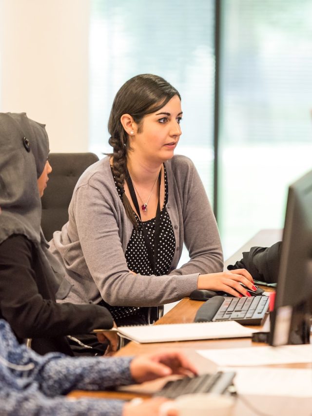 unknown persons using computer indoors