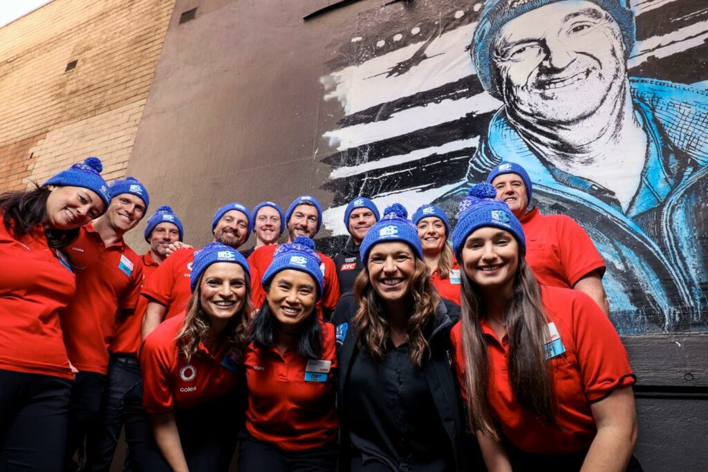 Coles-team-members-with-Collingwood-FCs-Taylor-Adams-and-FightMND-campaign-director-Bec-Daniher.jpg