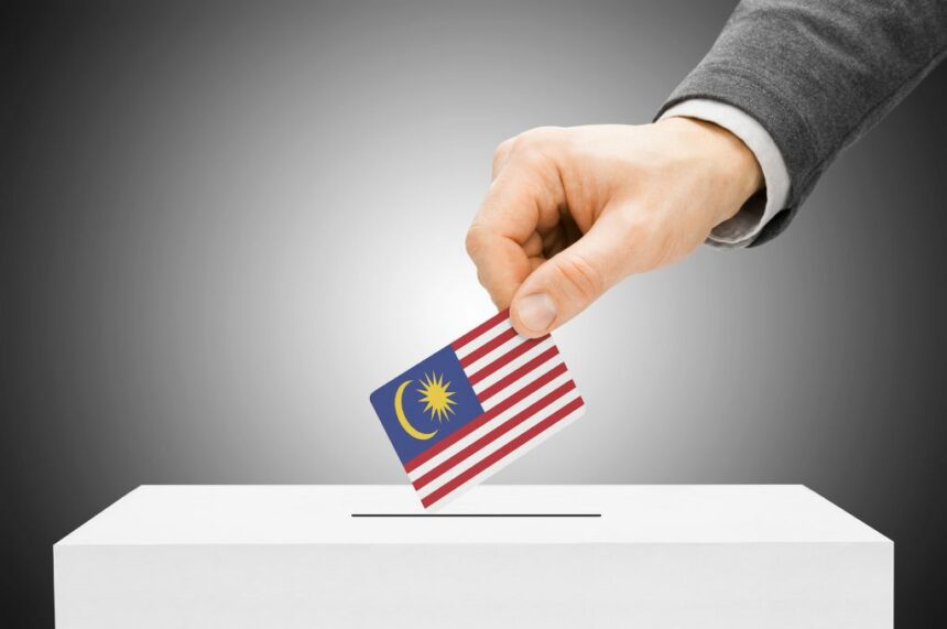 man inserting flag into ballot box