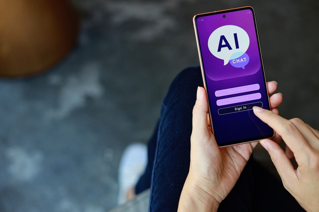 woman using smartphone chatting with AI chatbot