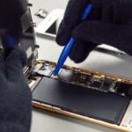 technician repairing smartphone