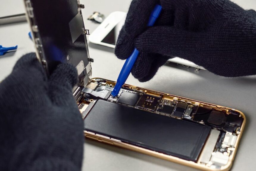 technician repairing smartphone