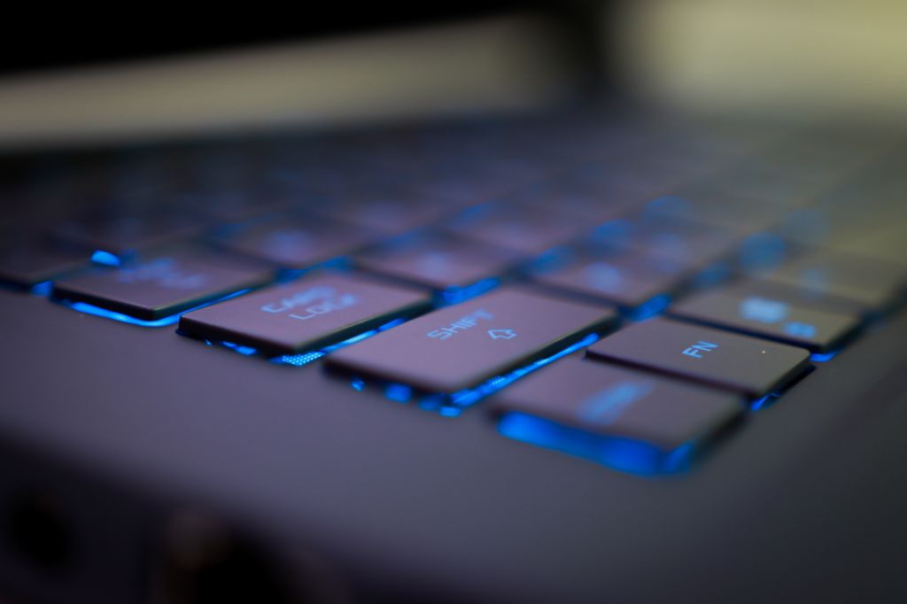 close up of blue lit laptop keyboard