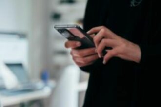 person holding black android smartphone