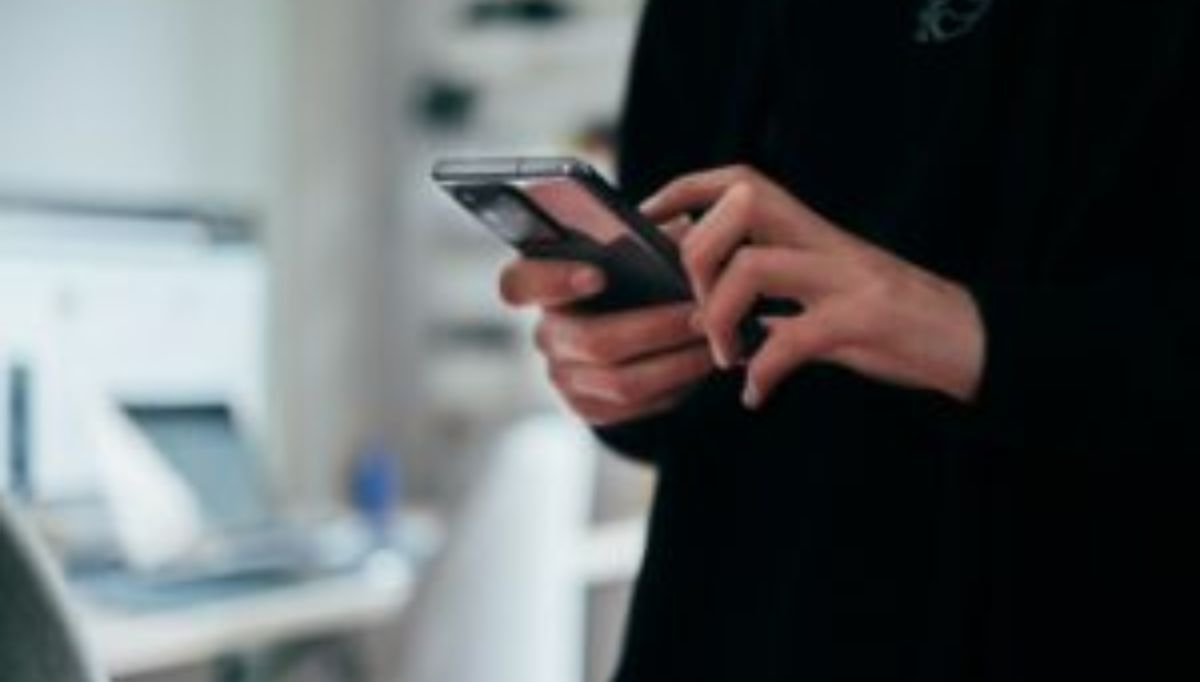 person holding black android smartphone