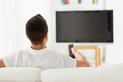 Man watching blank TV