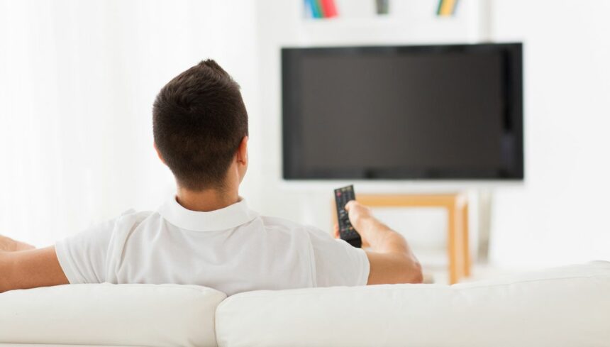 Man watching blank TV