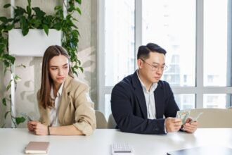 Man and woman sitting in a office